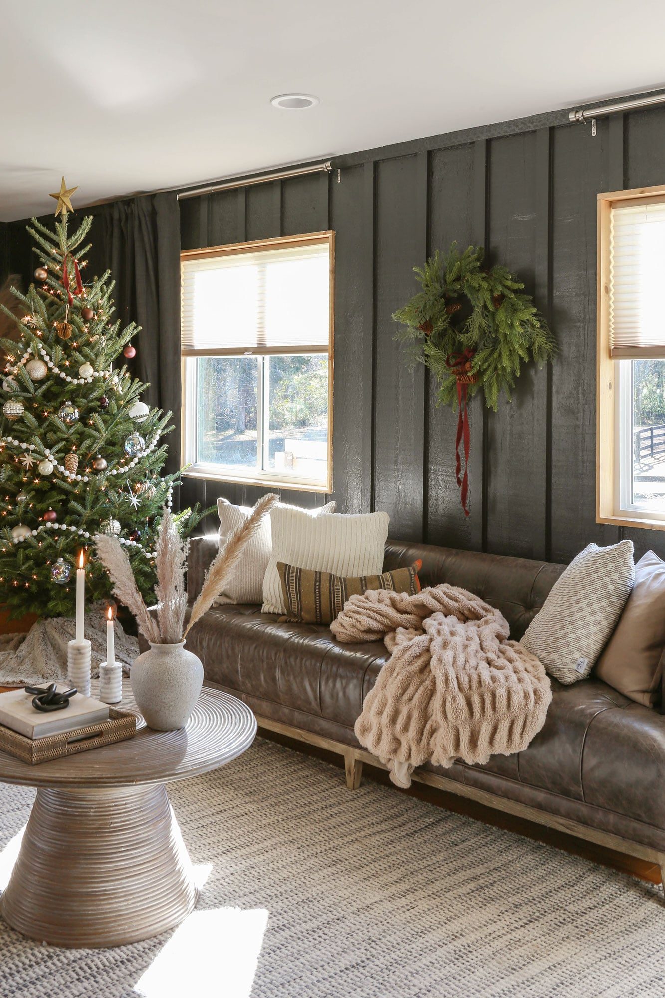 Modern Living Room with Dark Paneling and Cozy Christmas Decor — Modern Christmas Decor
