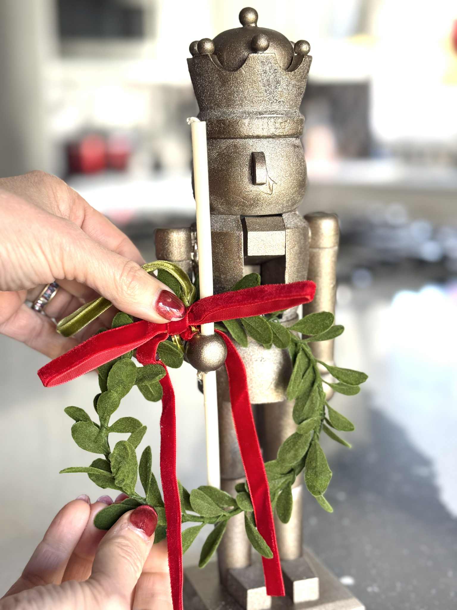 Decorating a Gold Nutcracker with Mistletoe Decorating a Gold Nutcracker with Mistletoe — Nutcracker Christmas Decor