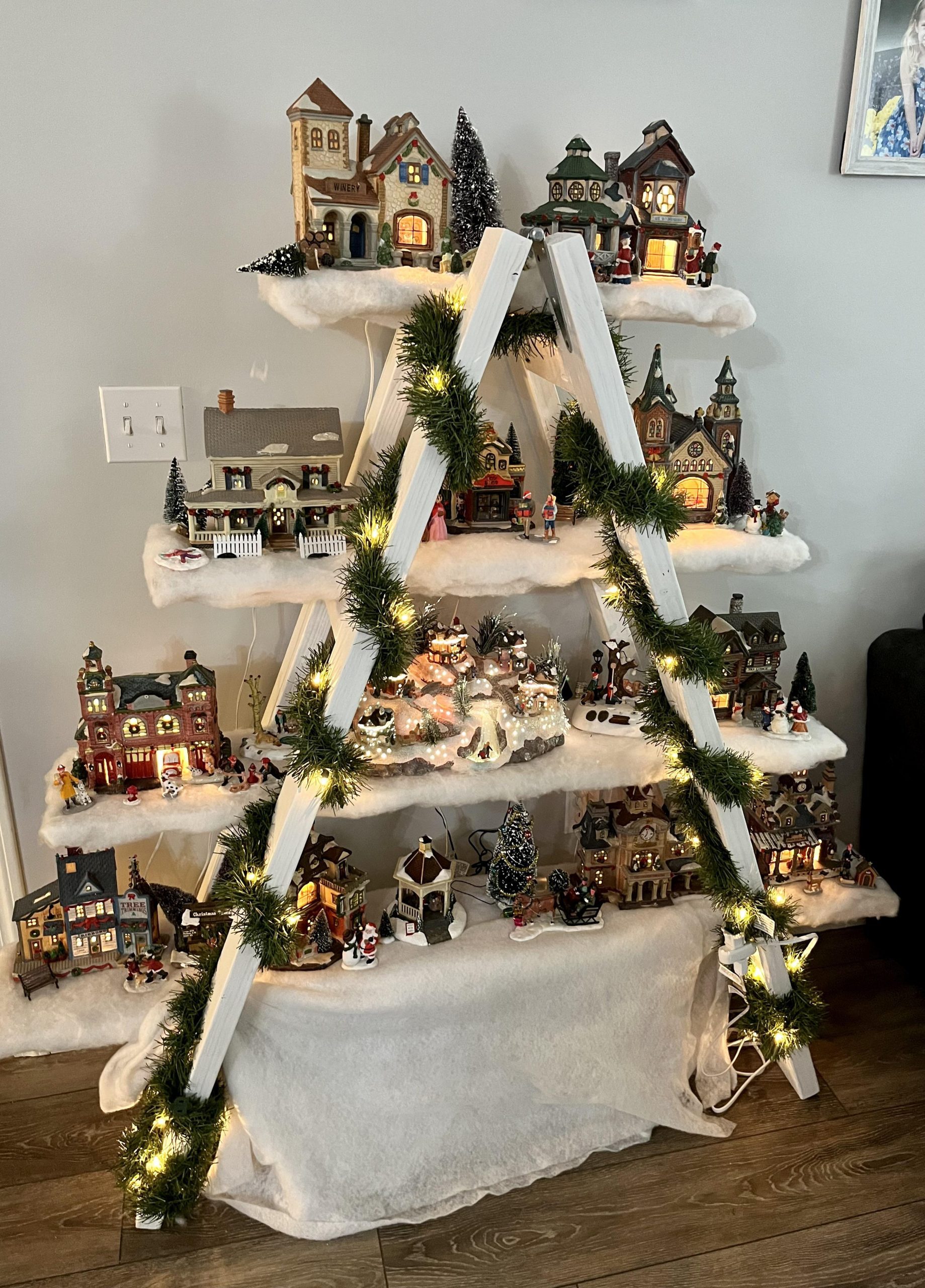 Whimsical Village Display on White Ladder Shelves Whimsical Village Display on White Ladder Shelves — Christmas Village Display