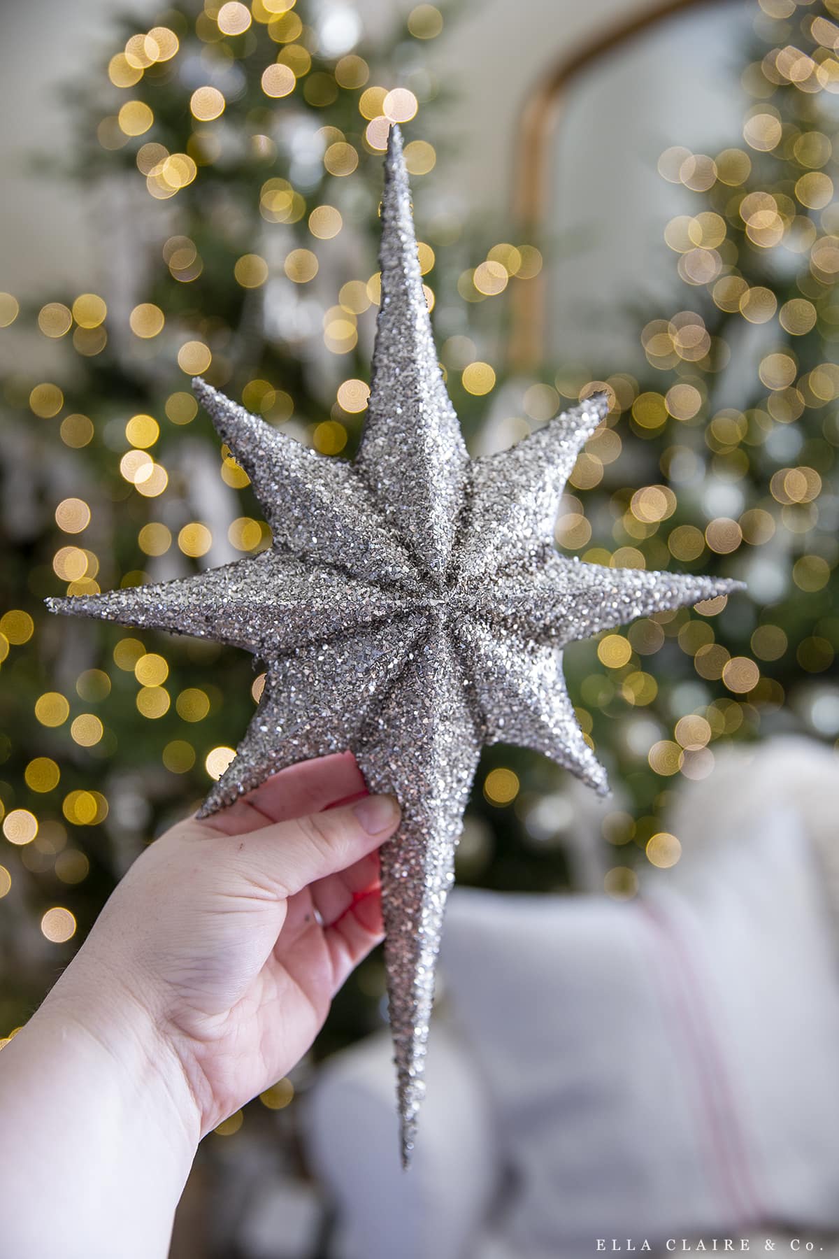 Sparkling Silver Star Topper Held by Hand — Christmas Tree Topper