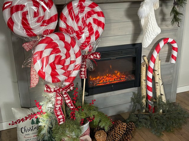 Whimsical Fireplace Decor with Giant Candy Cane — Candy Cane Christmas Decor