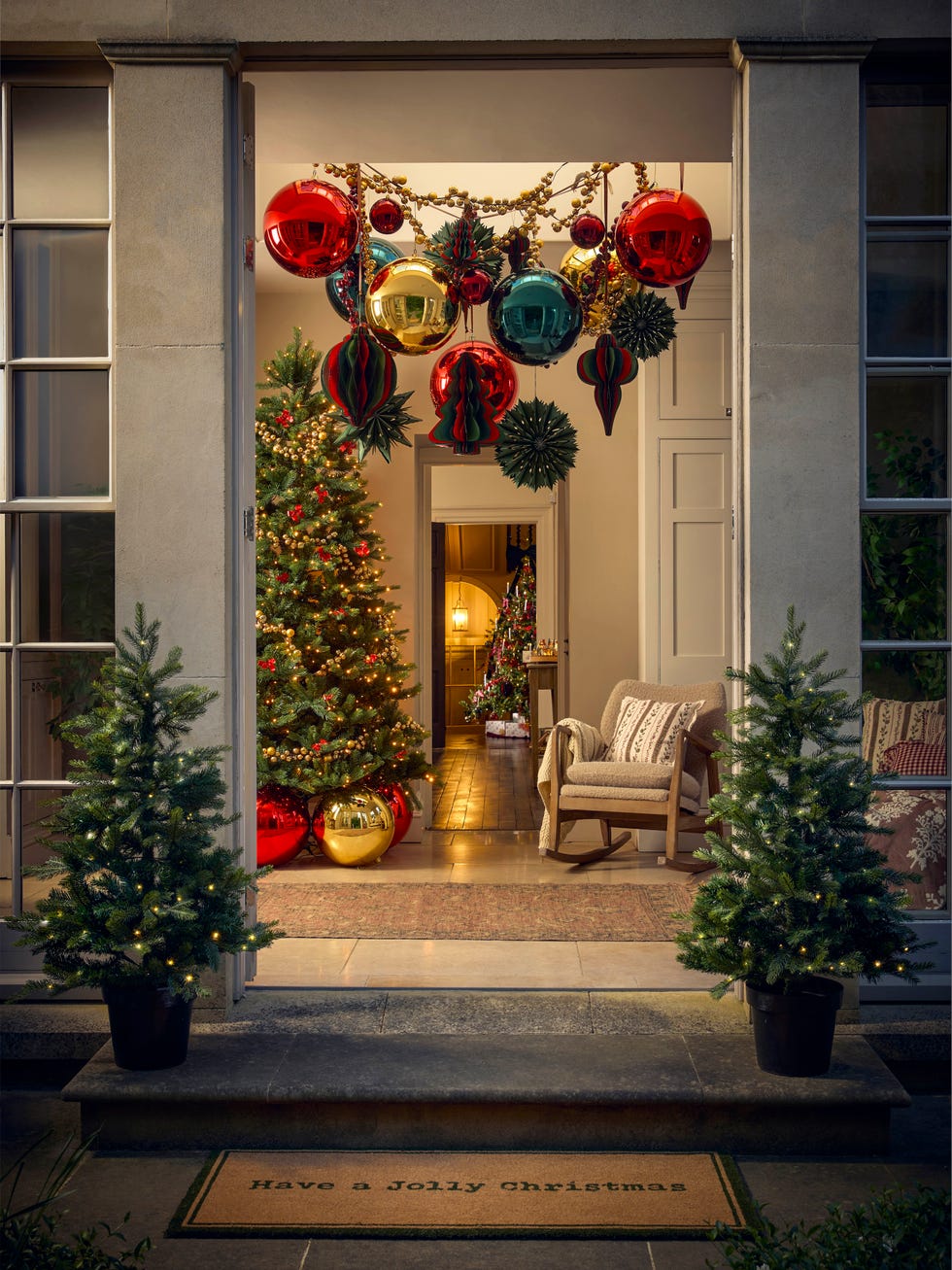 Welcoming Traditional Entryway with Overhead Baubles and Mini Trees Welcoming Traditional Entryway with Overhead Baubles and Mini Trees — christmas decor trends 2026