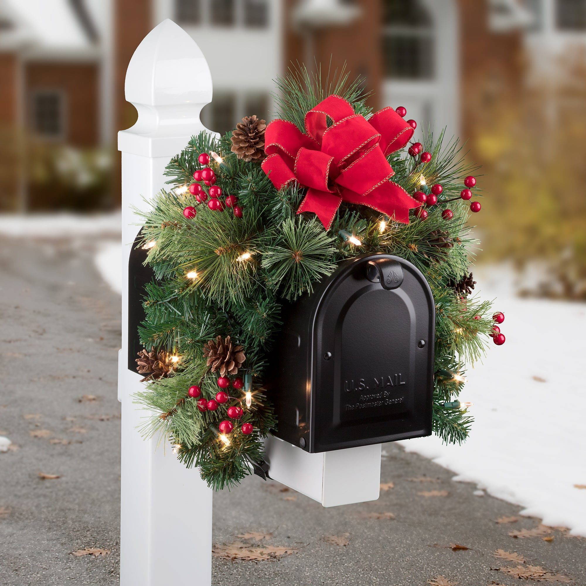 White Post Mailbox with Pine Garland, Red Berries, and Warm String Lights — Christmas Mailbox Decor