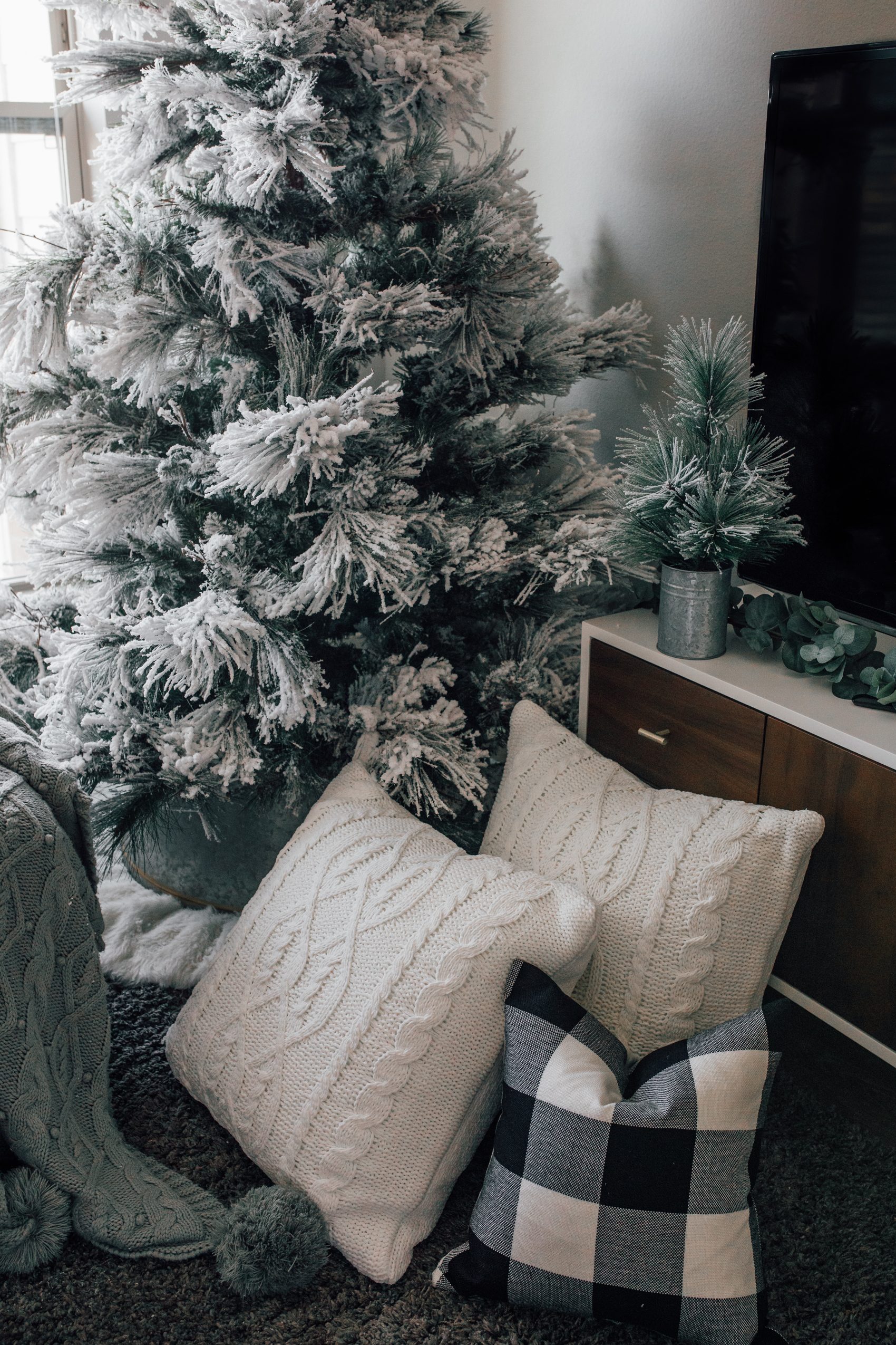 Modern Farmhouse Cozy: Flocked Tree with Knit and Buffalo Check Pillows Modern Farmhouse Cozy: Flocked Tree with Knit and Buffalo Check Pillows — Flocked Christmas Tree Decor