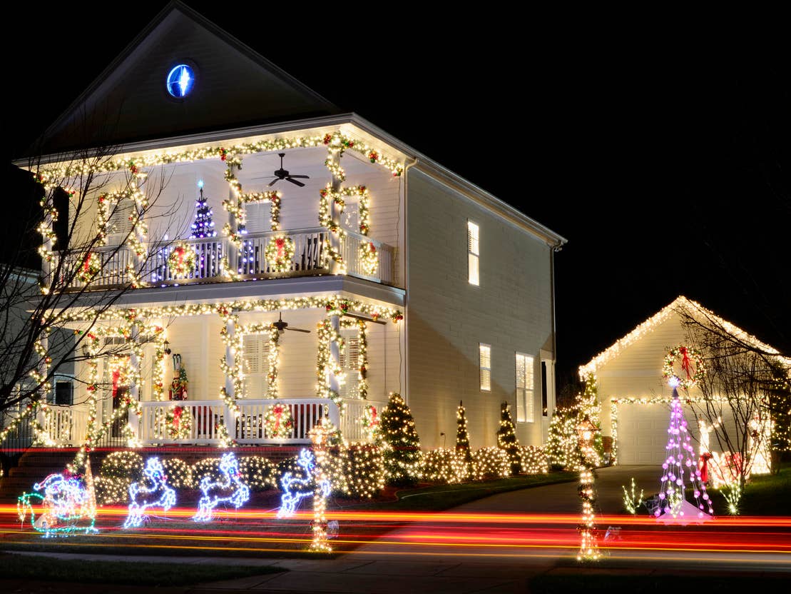 Extensive Colorful Christmas Lights Covering House and Yard — Christmas House Exterior Decor
