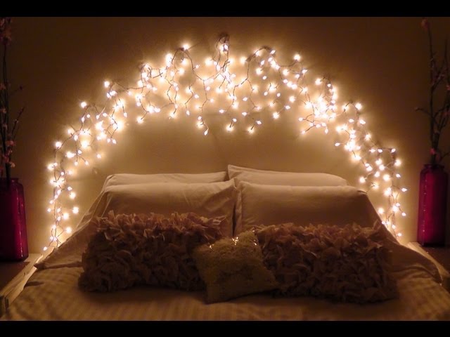 Minimalist Bedroom with an Arch of Fairy Lights Above the Headboard — Christmas Fairy Lights Headboard
