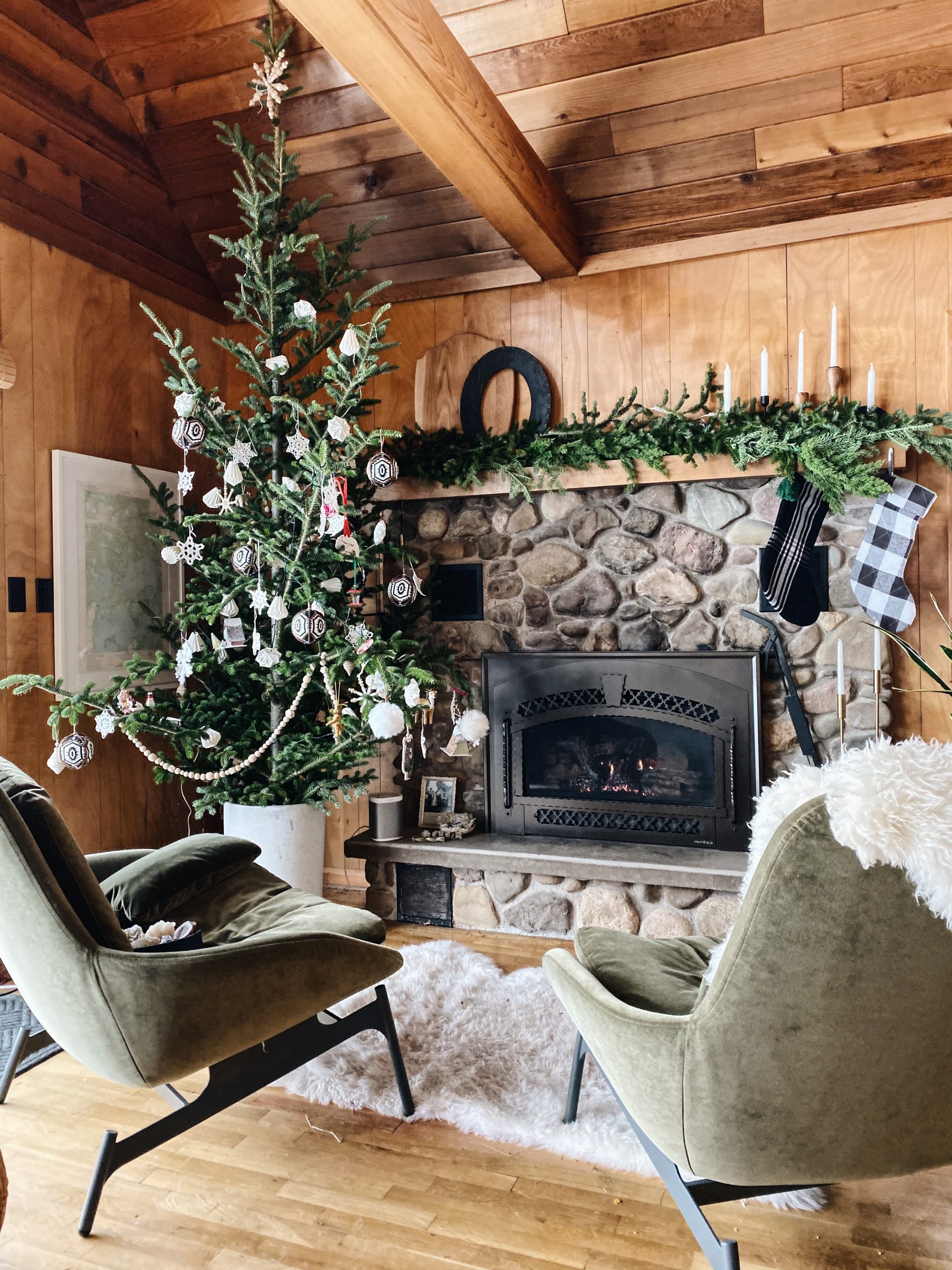 Farmhouse Living Room with Green Armchairs by Fireplace — Rustic Christmas Decor