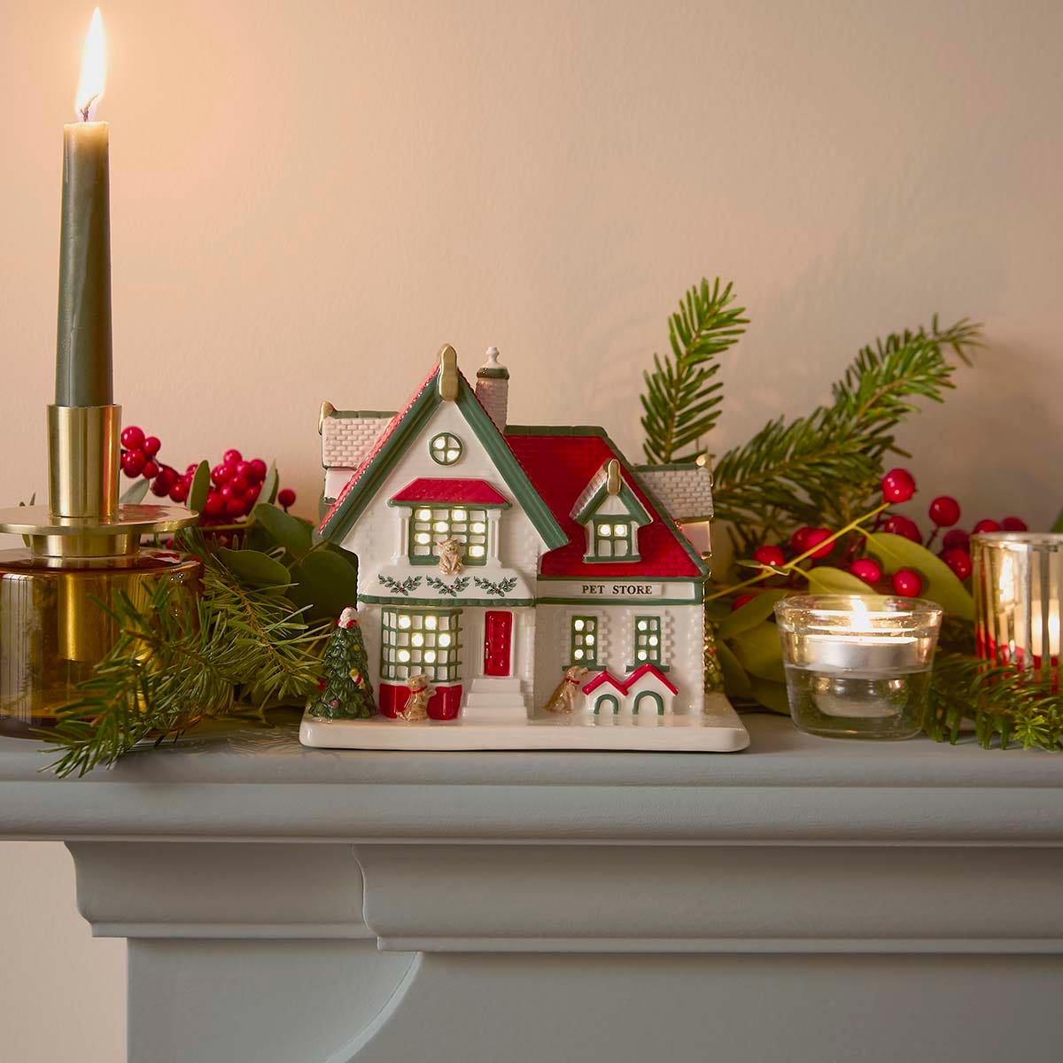 Elegant Ceramic Christmas Village House on a Mantelpiece Elegant Ceramic Christmas Village House on a Mantelpiece — Christmas Village Display