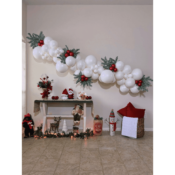 Elegant White Balloon Garland with Greenery Draped Above a Console Table Elegant White Balloon Garland with Greenery Draped Above a Console Table — Christmas Balloon Garland