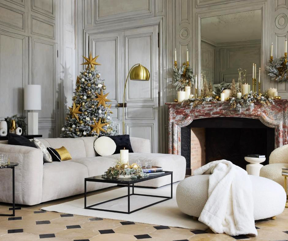 Chic Christmas Living Room with Flocked Tree and Gold Stars Chic Christmas Living Room with Flocked Tree and Gold Stars — christmas decor trends 2026