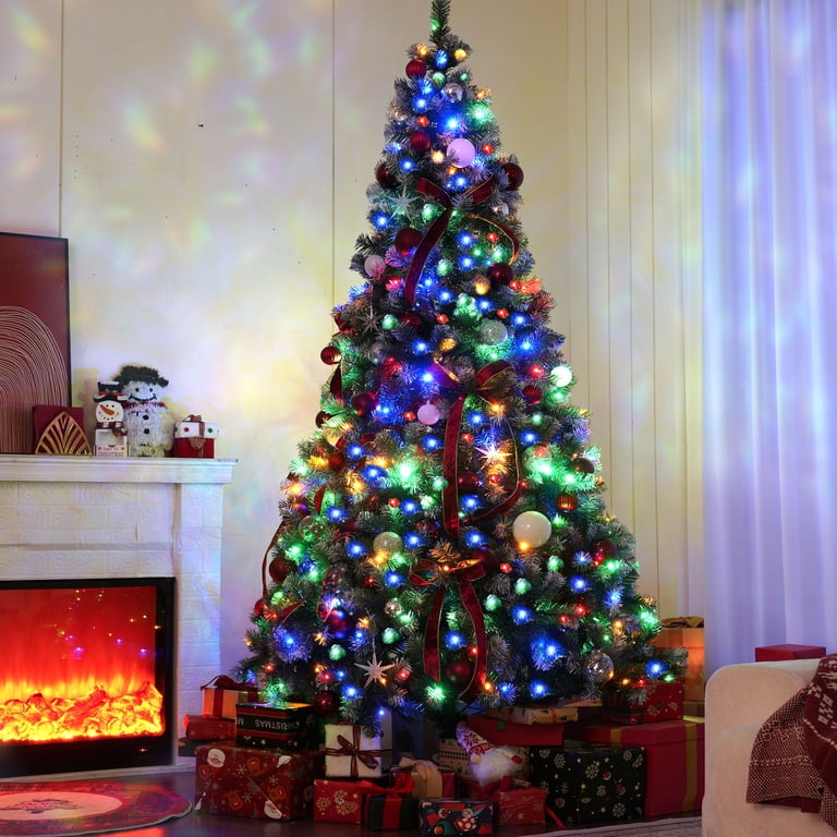 Festive Living Room with Tall Tree, Multicolor Lights, and Red Ribbons Festive Living Room with Tall Tree, Multicolor Lights, and Red Ribbons — Christmas Tree with Colored Lights