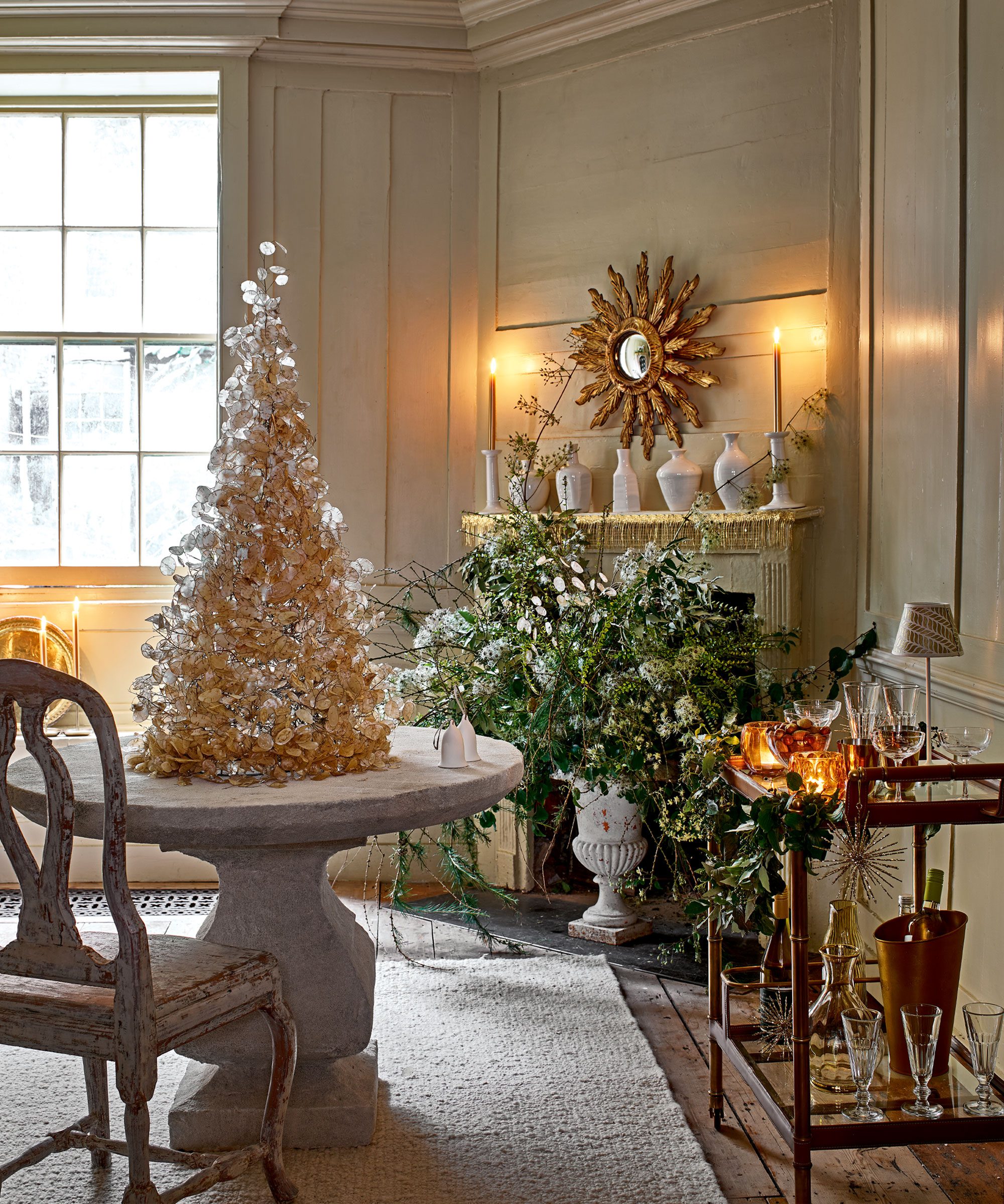 Elegant Dining Room with Sculptural Gold Decorative Tree and Bar Cart Elegant Dining Room with Sculptural Gold Decorative Tree and Bar Cart — christmas decor trends 2026