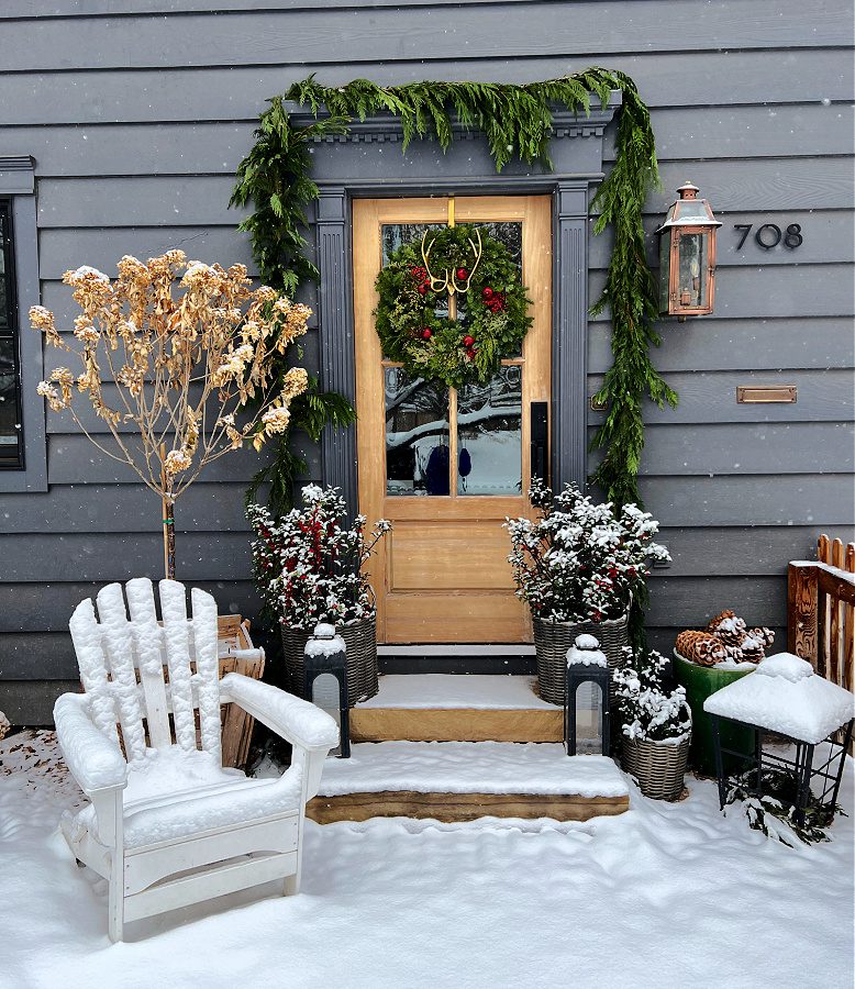 Modern Farmhouse Entrance with Snow-Covered Chair — Christmas House Exterior Decor