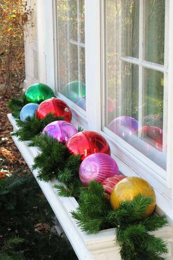 Vibrant Window Box with Large Ornaments and Evergreen Branches Vibrant Window Box with Large Ornaments and Evergreen Branches — Christmas Window Decor Outdoor