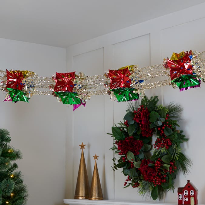 Shimmering Tinsel Garland with Starburst Accents Shimmering Tinsel Garland with Starburst Accents — Christmas Garland