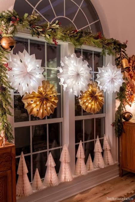 Glowing Paper Snowflakes in a Festive Window Display