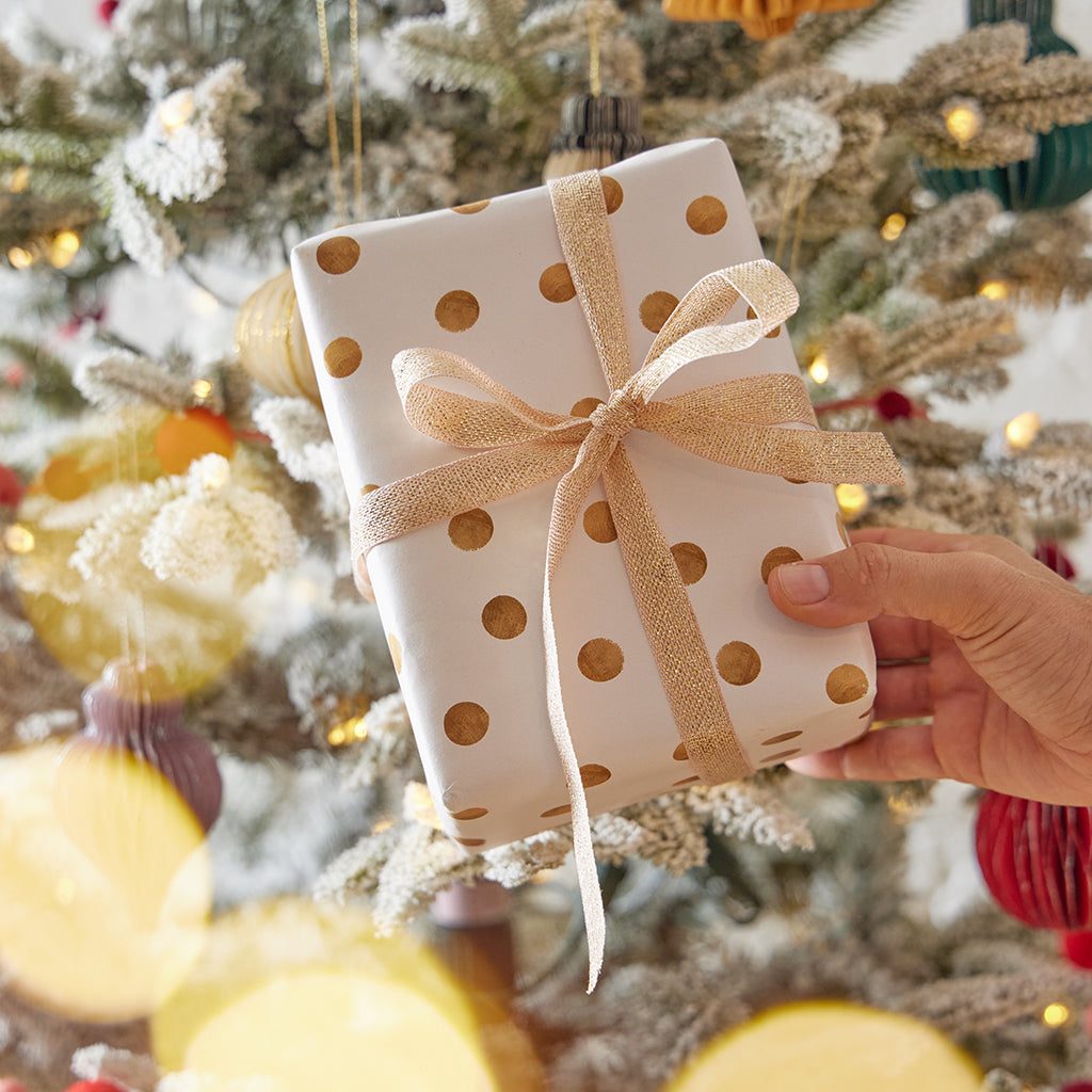 Polka Dot Gift with Gold Accents Under a Twinkling Tree — Christmas Gift Wrapping