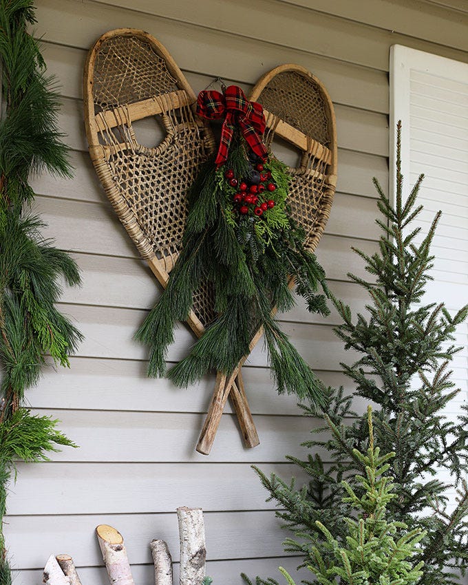 Outdoor Porch Decor with Snowshoes and Pine Boughs Outdoor Porch Decor with Snowshoes and Pine Boughs — Winter Decor After Christmas