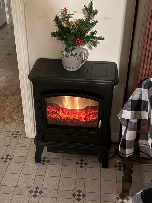 Freestanding Electric Fireplace with Evergreen Branches Freestanding Electric Fireplace with Evergreen Branches — Winter Decor After Christmas