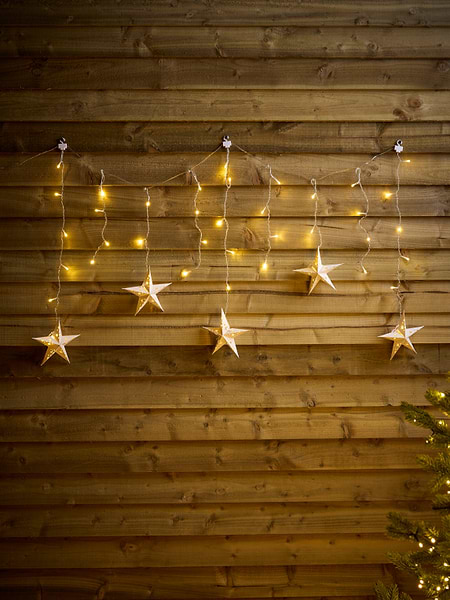 Farmhouse Porch with Star Ornaments and Fairy Lights Farmhouse Porch with Star Ornaments and Fairy Lights — Christmas Fairy Lights Wall