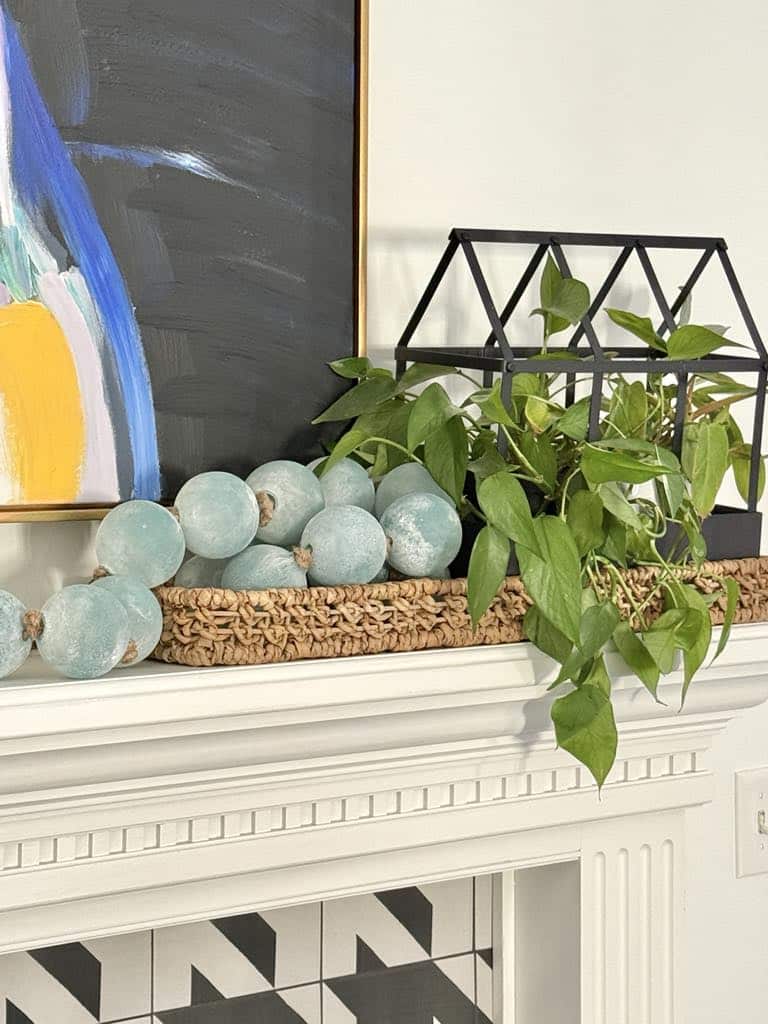 Modern Mantel with Abstract Art and Greenery Modern Mantel with Abstract Art and Greenery — Winter Mantel Decor