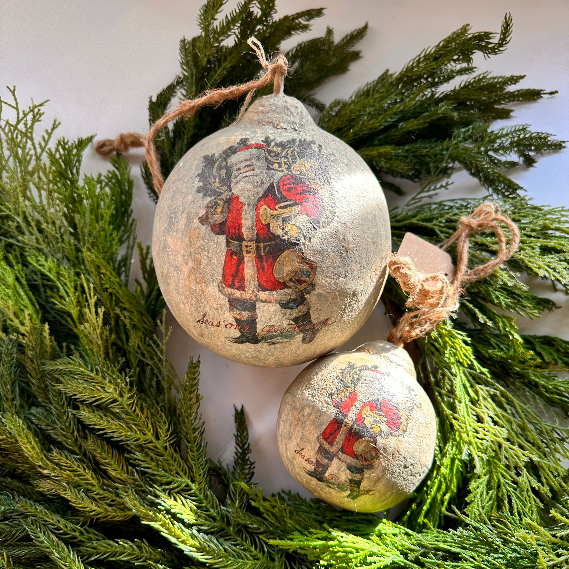 Ornaments with Vintage Santa Imagery on Evergreen Branches Ornaments with Vintage Santa Imagery on Evergreen Branches — Vintage Christmas Decor