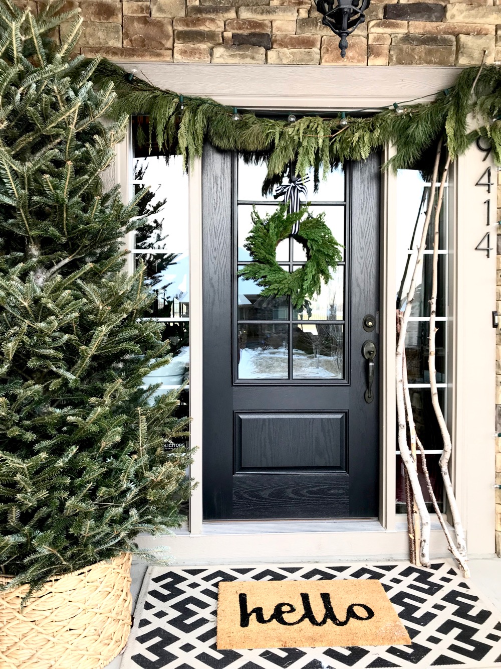 Modern Farmhouse Porch Entrance with Christmas Tree and Garland Modern Farmhouse Porch Entrance with Christmas Tree and Garland — Winter Porch Decor