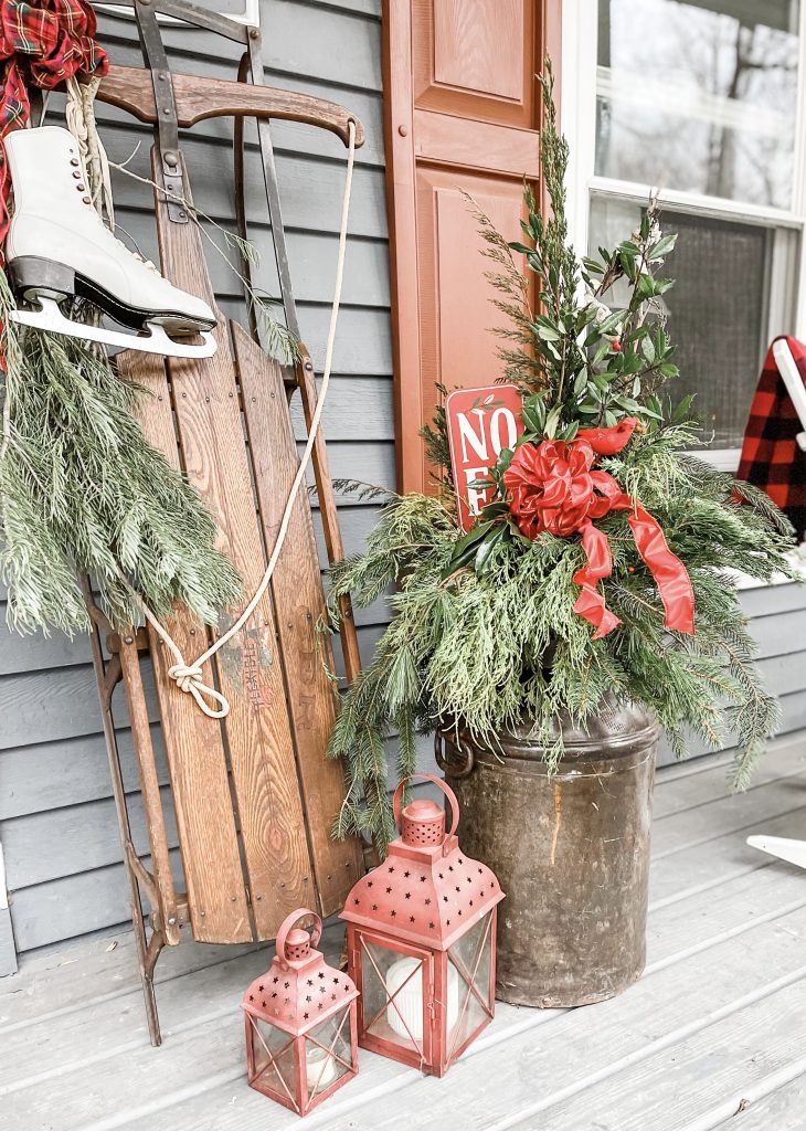Vintage Milk Can Planter with Greenery and Red Bow — Christmas Porch Planters