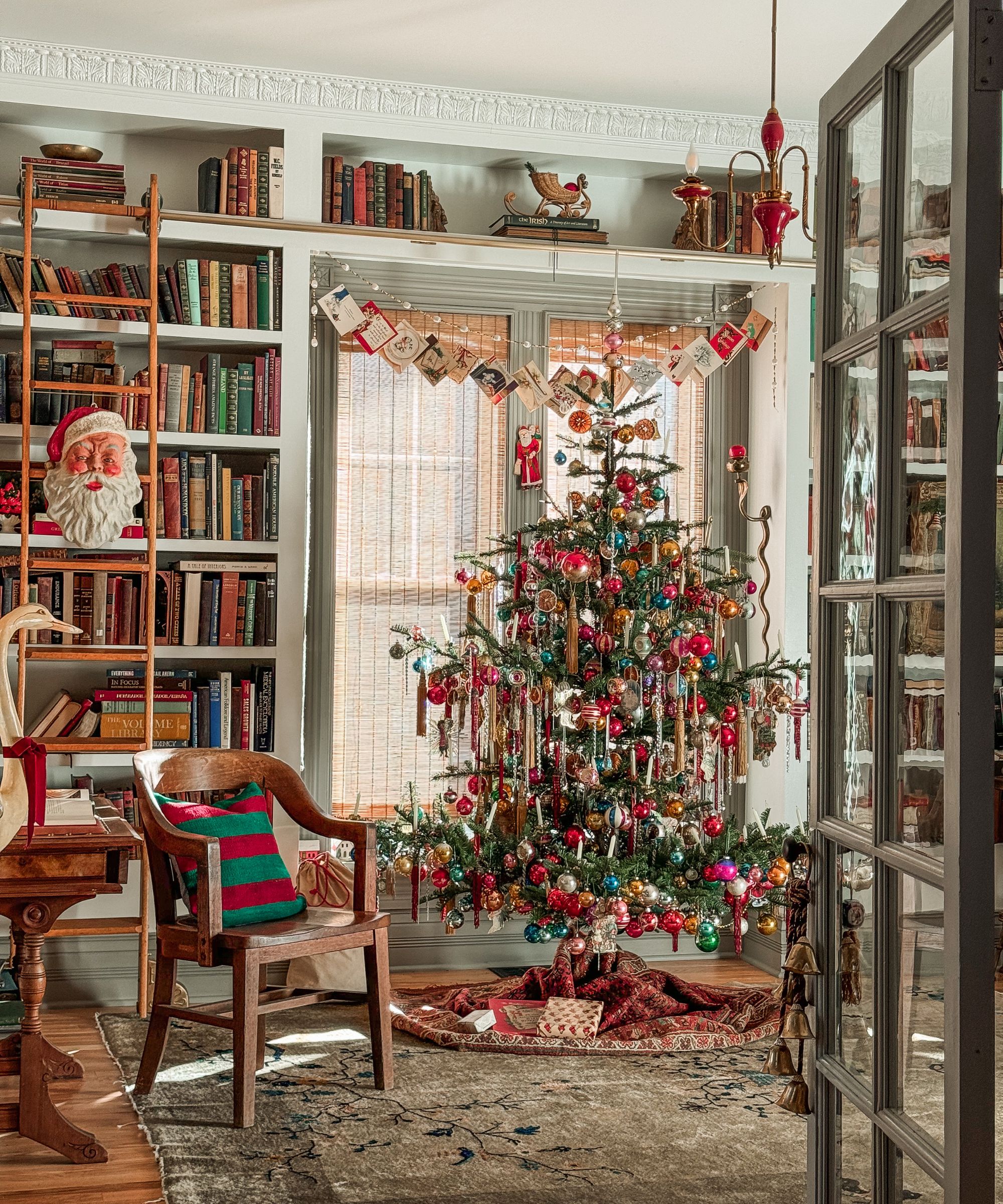 Elaborately Decorated Vintage Christmas Tree in a Book-Filled Room Elaborately Decorated Vintage Christmas Tree in a Book-Filled Room — Vintage Christmas Decor
