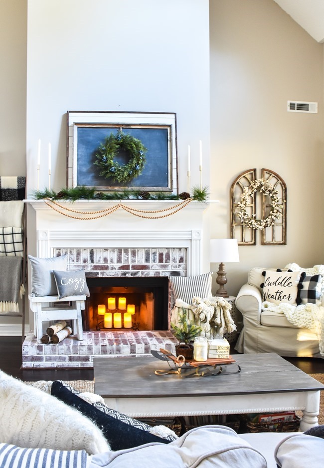 Neutral Mantel with Framed Winter Art and Candles Neutral Mantel with Framed Winter Art and Candles — Winter Mantel Decor