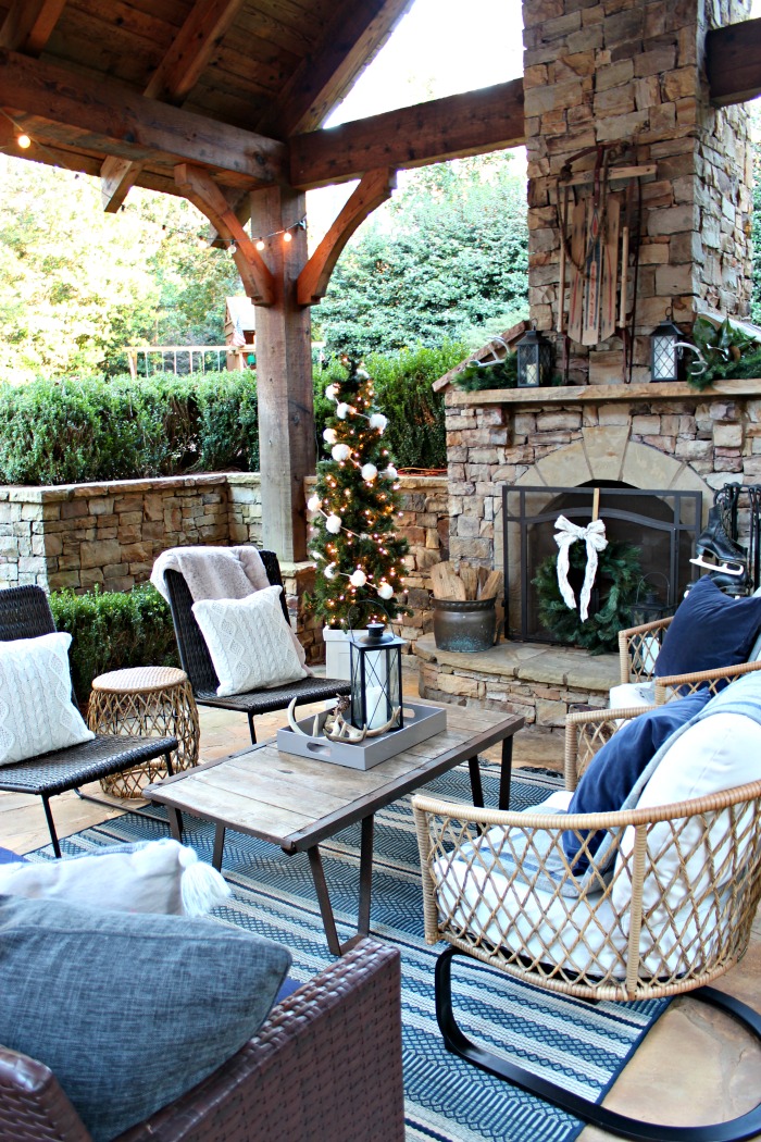 Rustic Covered Porch with Stone Fireplace and Evening Ambiance Rustic Covered Porch with Stone Fireplace and Evening Ambiance — Winter Porch Decor
