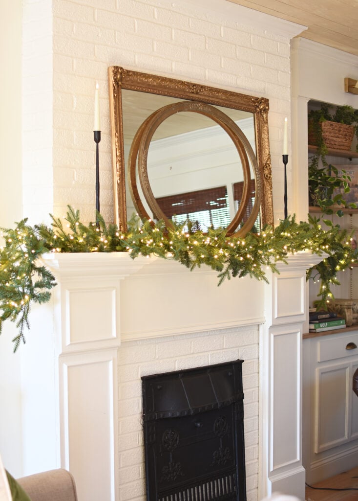 Farmhouse Mantel with Lush Pine Garland and Ornate Mirror Farmhouse Mantel with Lush Pine Garland and Ornate Mirror — Winter Mantel Decor