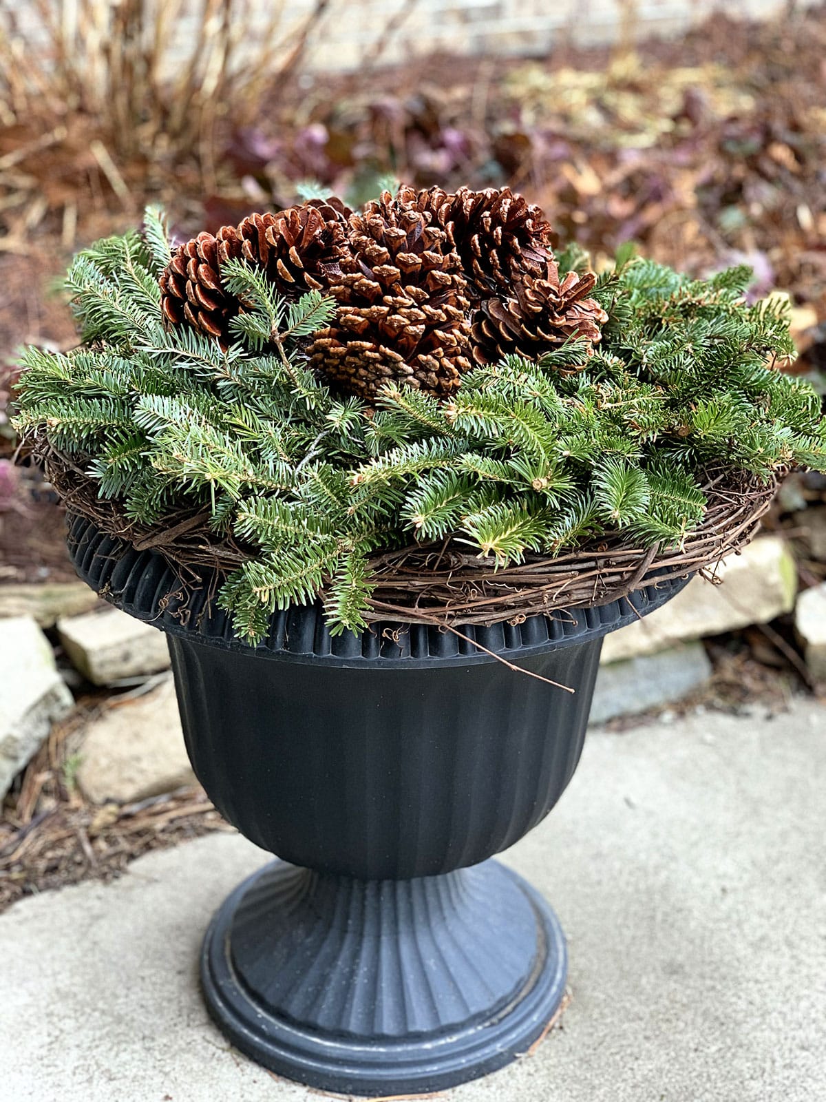 Rustic Urn Planter Overflowing with Pine Cones and Evergreen — Christmas Porch Planters