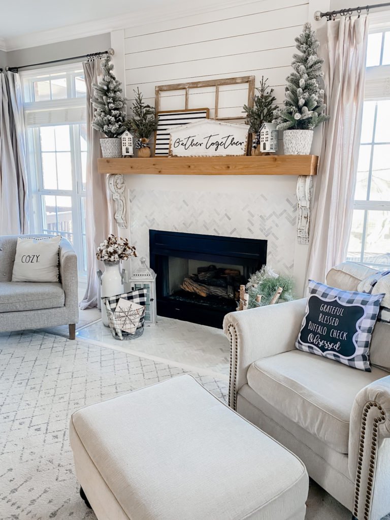 Living Room Neutral Farmhouse Mantel with Frosted Trees and Lanterns Living Room Neutral Farmhouse Mantel with Frosted Trees and Lanterns — Winter Mantel Decor