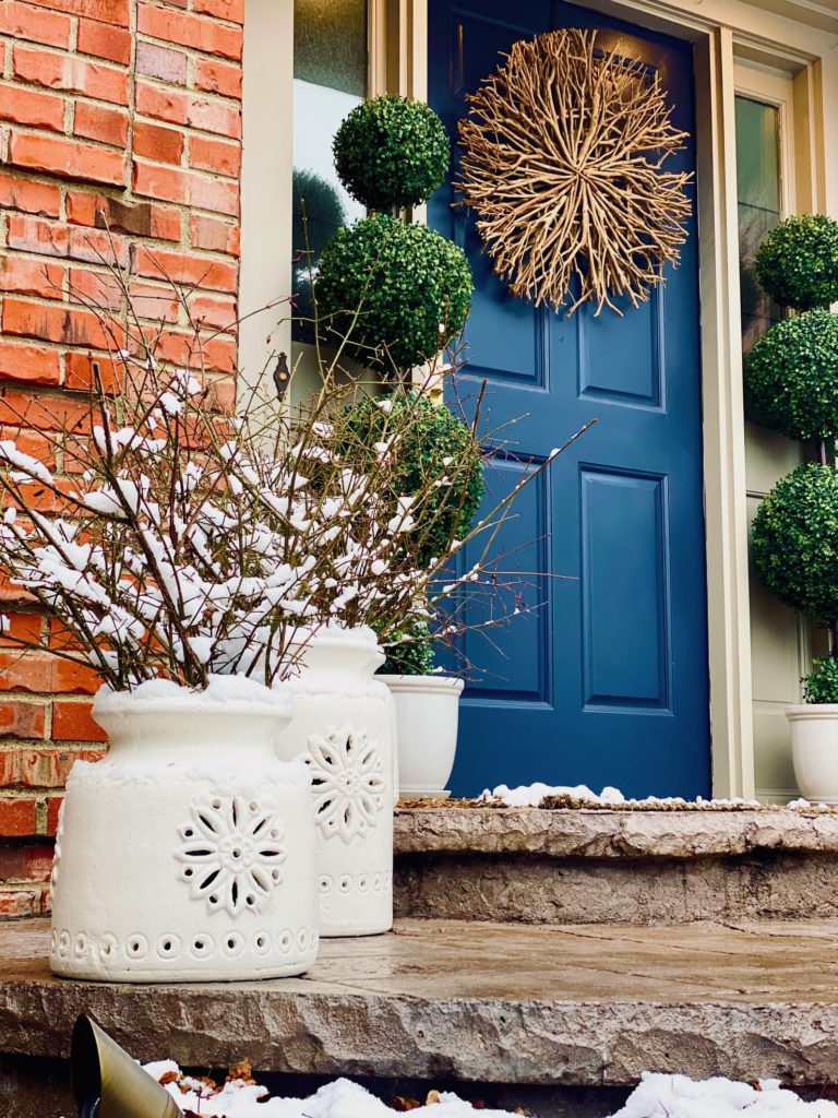 Vibrant Blue Door with Snow-Dusted Branches and Twig Wreath Vibrant Blue Door with Snow-Dusted Branches and Twig Wreath — Winter Porch Decor